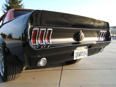 The matte black tail panel adds a nice aggressive feel to the back of the Mustang. The bumper bolts have been shaved and the brackets welded to the bumper for smooth clean appearance.