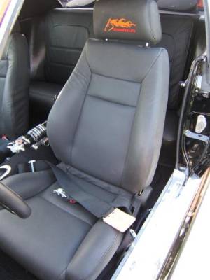 Custom leather Elite black leather seats. If you look closely you can see the orange Stang-Aholics horse head logo embroidered into the seat head rests.