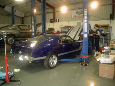 Picture lowered on lift while performing engine compartment work.