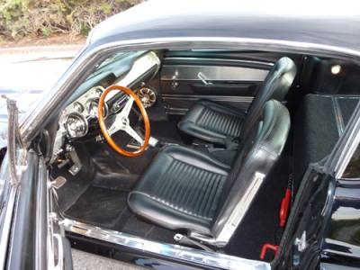 Interior has the Deluxe brushed aluminum dash and door panel inserts, trick Hurst shifer controlling a 5 speed overdrive with silky smooth cable operated clutch.